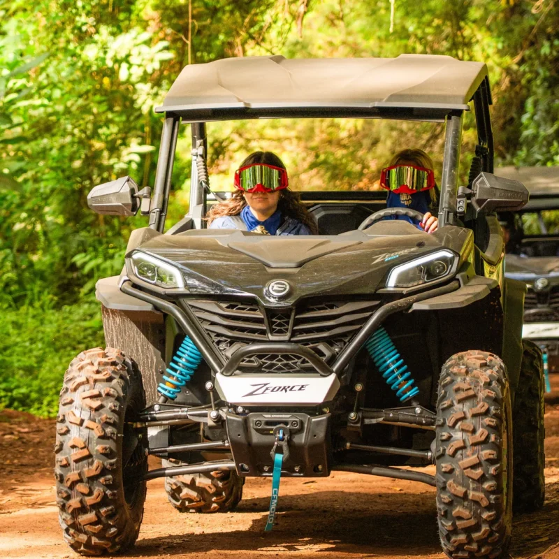 Two guests in goggles driving a buggy on a forest trail during the Funduras tour, Madeira